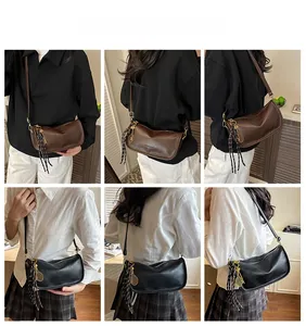 Detail shots of black and brown crescent bags with tennis racket charms and stripe ribbons