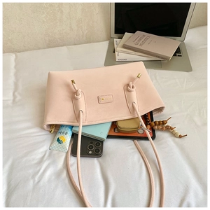 Internal view of pink tote bag showing spacious capacity for phone, notes and daily items