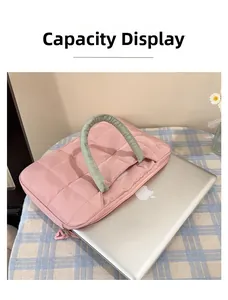 Pink quilted laptop sleeve for 14 inch computer with thick green padded handles