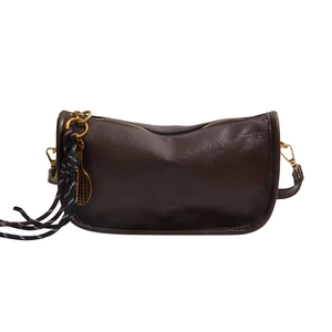 Deep brown faux leather tote bag with tennis racket pendant and golden zipper detail