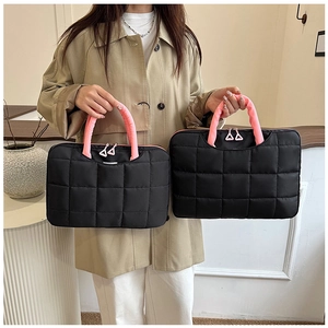 Quilted 14-inch laptop bag details showing size comparison and pink contrast handles