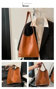 Detailed views of a brown faux leather tote bag with gold fashion lettering and large capacity
