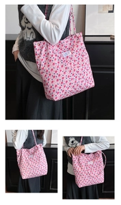 Detail of pink floral tote bag with bubble crinkle texture and white brand label