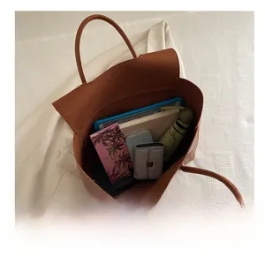 Top view of brown crocodile pattern tote bag showing large capacity for tablet and items