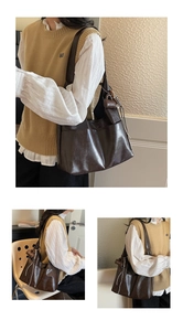 Detail of dark brown leather hobo bag with a decorative ribbon and textured soft finish