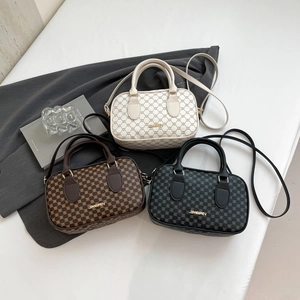 Classic monogram crossbody bags in white, brown, and black with top handles and straps