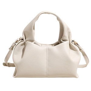 Chic cream white leather dumpling bag with textured finish and adjustable strap