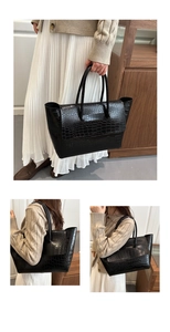 Detailed view of black crocodile pattern tote bag with large capacity and sturdy dual handles