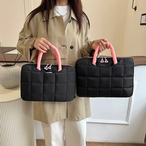 Quilted black laptop bag with pink handles, shown in 14-inch and large size variants