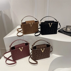 Stylish leopard print tote bags in four colors with gold V hardware and crossbody straps