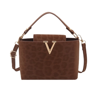Leopard print crossbody bag with golden V-shaped buckle and adjustable shoulder strap