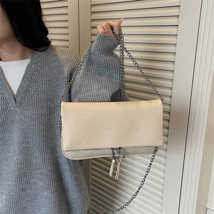 Chic beige lychee texture chain crossbody bag with folding flap and dual zipper detail