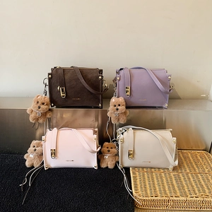 Minimalist square box bag in four colors with adjustable straps and bear charms