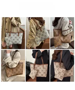 Chic monogram tote bag set shown on model for elegant daily commuting style
