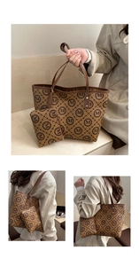 Detail view of brown monogram canvas tote bag with matching pouch and stylish brown handles