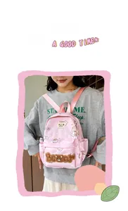 Detailed view of pink backpack with bear prints and 3D plush embroidery patch