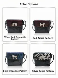 Detail view of large bow crossbody bags in burgundy, red, blue and silver textured finishes