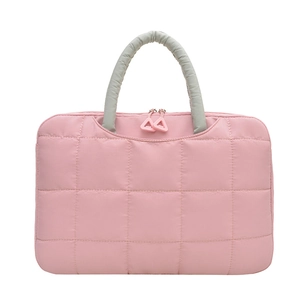 Pink quilted shoulder bag with grey handles and waterproof nylon texture on white background