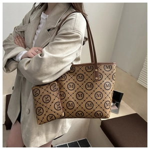 Brown monogram tote bag set with matching pouch styled on a casual beige wool coat