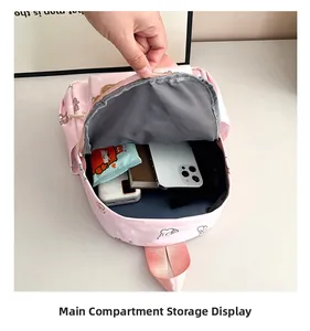Internal storage view of the pink cartoon backpack showing main compartment capacity