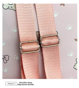 Detailed view of adjustable pink woven shoulder strap with silver metal buckle