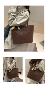 Detail view of stylish leopard print tote bag featuring a decorative silk scarf on strap