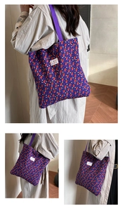 Close-up of the purple floral bubble texture fabric and brand label on the tote bag