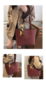 Close-up of burgundy leopard print tote bag featuring decorative patterned silk scarf