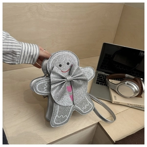 Détail du sac à bandoulière bonhomme de pain d'épice à paillettes argentées et nœud