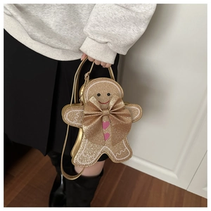 Détail du sac bonhomme de pain d'épices scintillant avec nœud 3D et cœurs