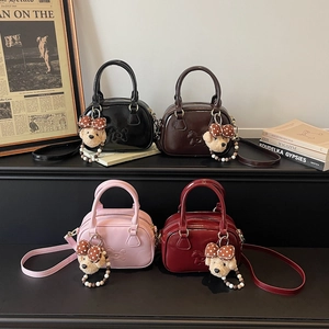 Mini bowling handbags in four colors with cute teddy bear charms and shoulder straps