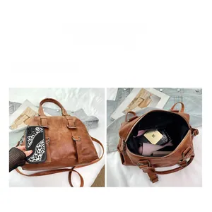 Detailed view of the large capacity brown PU leather tote bag with internal storage layout