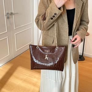 Deep brown crocodile texture tote bag with gold chain and deer charm pendant