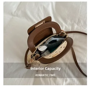 Internal capacity of the retro polka dot crossbody bag showing daily essentials