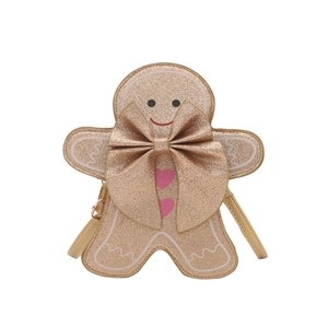 Sac bandoulière bonhomme de pain d'épices avec paillettes et nœud doré sur fond blanc