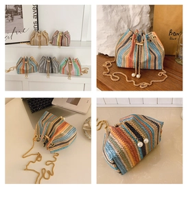 Close-up of colorful straw bucket bag with woven texture, pearl drawstring and gold chain