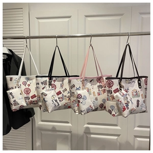 Detail view of cartoon print tote bag set featuring small pouch and four handle colors