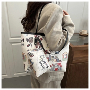 Detail of canvas tote bag with colorful cartoon illustrations and matching small pouch