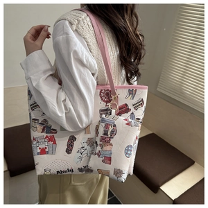 Detail of graffiti print tote bag with matching pink coin purse and urban city illustration