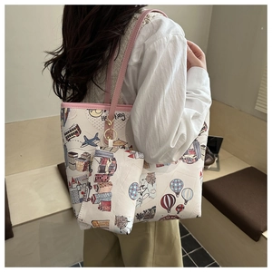 Detail view of large graffiti tote bag with Hong Kong print and matching inner pouch
