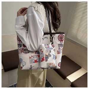 Detail view of graffiti tote bag with Hong Kong city print and matching mini pouch