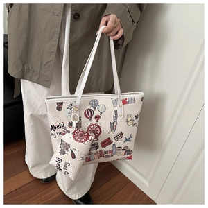 Detail of cute bear tote bag with city travel illustrations and a matching small pouch