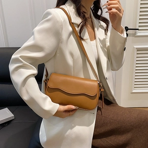 Chic caramel brown wavy flap shoulder bag for women with minimalist retro design