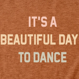Close-up of terracotta cotton shirt showing IT'S A BEAUTIFUL DAY TO DANCE print