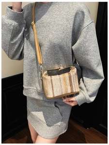 Ethnic style crossbody box bag with brown woven stripes and vintage metal clasp details