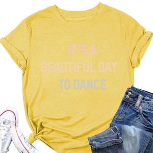 Detail of yellow cotton T-shirt with 'IT'S A BEAUTIFUL DAY TO DANCE' slogan and side knot