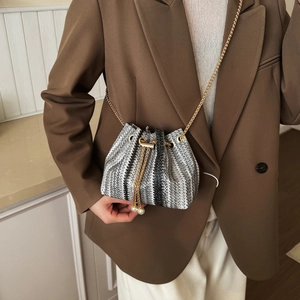 Chic rainbow woven bucket bag with pearl pendant and gold chain strap for women