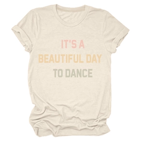 Detail of the crew neck collar and colorful text print on the cream cotton t-shirt