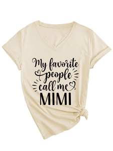 Macro detail of V-neck cotton T-shirt with knot hem and 'MIMI' slogan printing