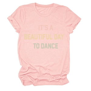 Detail of light pink T-shirt featuring IT'S A BEAUTIFUL DAY TO DANCE gradient print